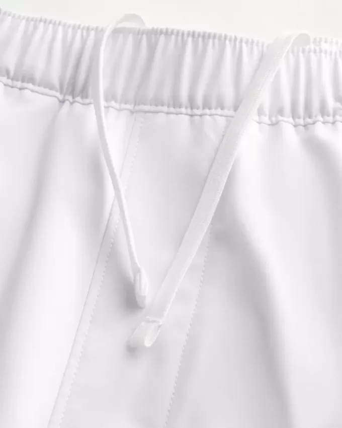 Pantaloncini ibridi attivi a metà coscia