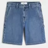 Pantaloncini in denim larghi da pittore con lavaggio medio