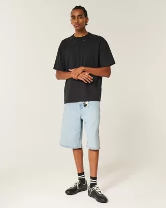 Pantaloncini in denim super larghi con decorazioni lavaggio chiaro