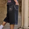 Pantaloncini in denim super larghi con grafica di gatti neri lavati