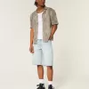 Pantaloncini in denim super larghi con grafica Dice e lavaggio chiaro