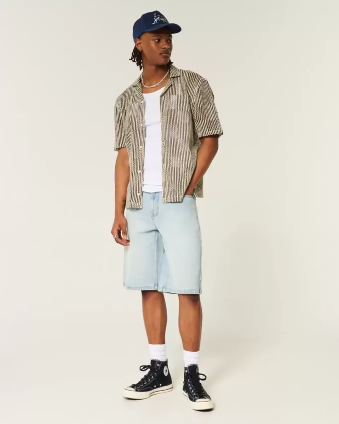 Pantaloncini in denim super larghi con grafica Dice e lavaggio chiaro