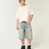 Pantaloncini in denim super larghi con lavaggio medio ingrassato