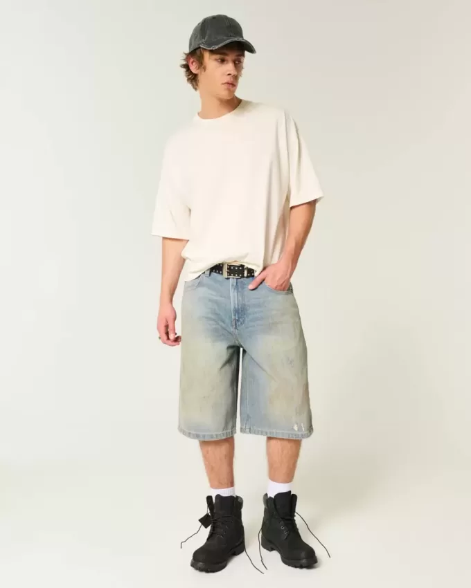 Pantaloncini in denim super larghi con lavaggio medio ingrassato