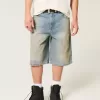 Pantaloncini in denim super larghi con lavaggio medio ingrassato