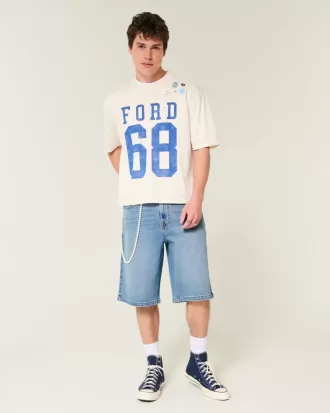 Pantaloncini in denim super larghi con lavaggio medio sotto il ginocchio
