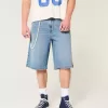Pantaloncini in denim super larghi con lavaggio medio sotto il ginocchio