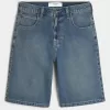 Pantaloncini in denim super larghi lavaggio scuro sotto il ginocchio