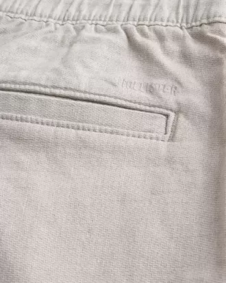 Pantaloncini in misto lino con parte anteriore piatta fino al ginocchio