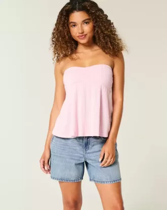 Pantaloncini larghi in denim a vita bassa con risvolto e lavaggio medio, 5″