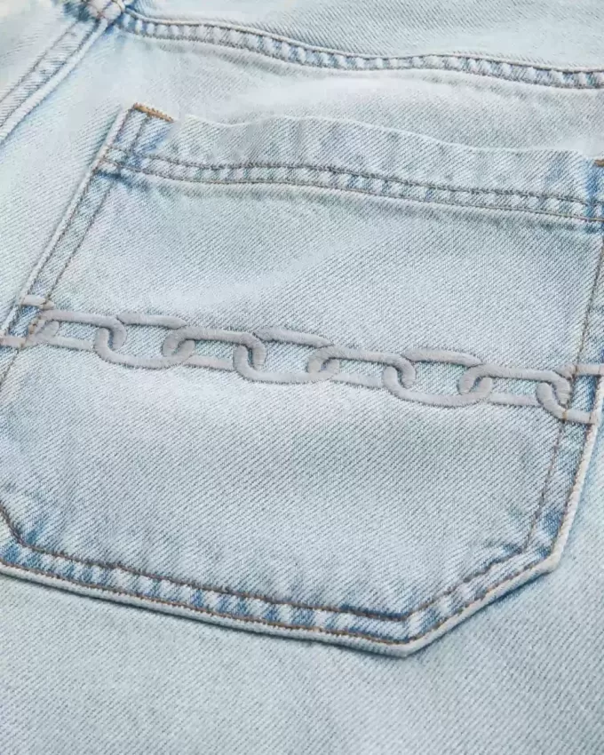 Pantaloncini larghi in denim con ricamo a catena