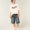Pantaloncini larghi in denim con stampa serpente