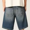 Pantaloncini larghi in denim con stampa serpente