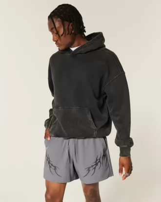 Pantaloncini sportivi con grafica a metà coscia