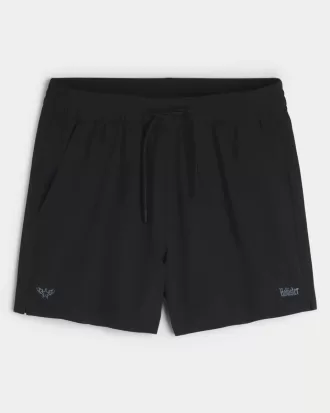 Pantaloncini sportivi con logo a metà coscia