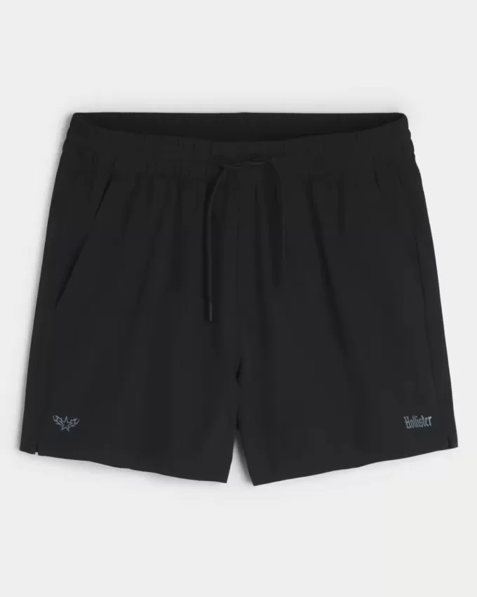Pantaloncini sportivi con logo a metà coscia