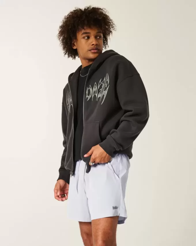 Pantaloncini sportivi con logo a metà coscia