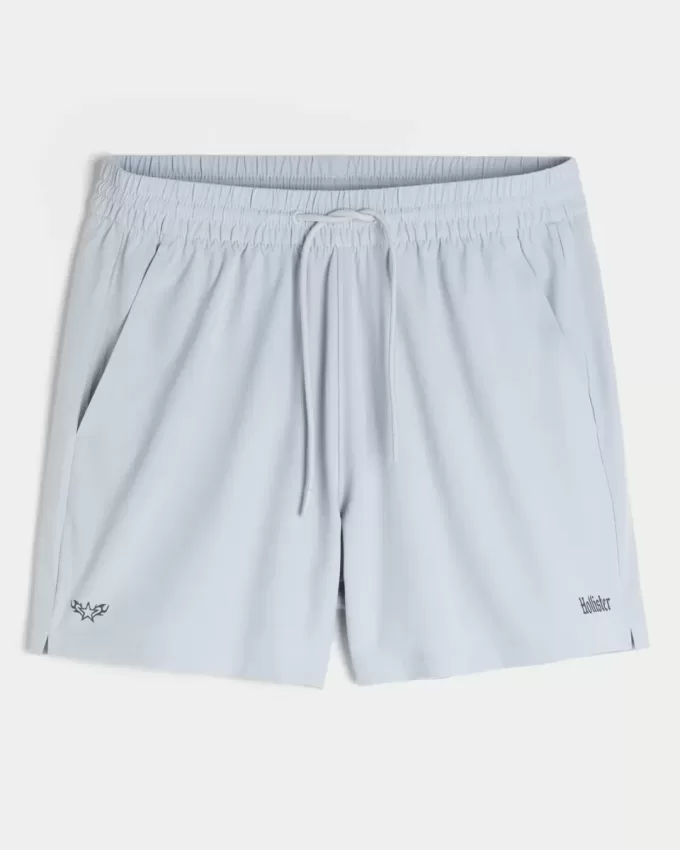 Pantaloncini sportivi con logo a metà coscia