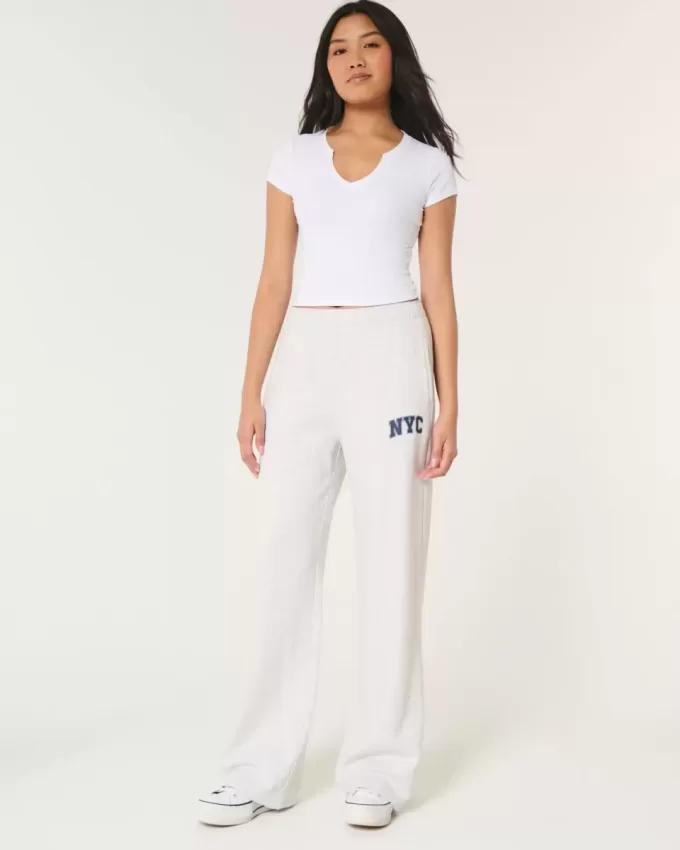 Pantaloni a gamba larga in pile con grafica NYC Pantaloni a gamba larga in pile con grafica NYC
