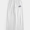 Pantaloni a gamba larga in pile con grafica NYC Pantaloni a gamba larga in pile con grafica NYC