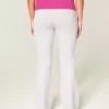 Pantaloni a zampa con risvolto e grafica ibisco
