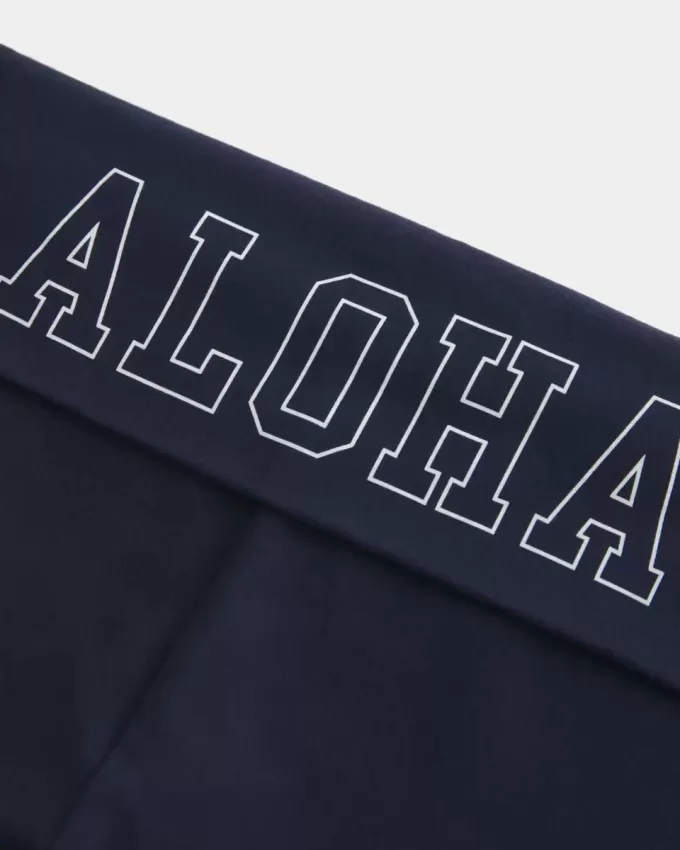 Pantaloni a zampa con vita ripiegata e grafica Aloha