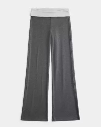 Pantaloni a zampa in maglia con risvolto in vita