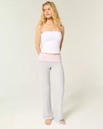 Pantaloni a zampa in maglia con risvolto in vita
