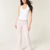 Pantaloni a zampa in maglia con risvolto in vita