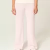 Pantaloni a zampa in maglia con risvolto in vita
