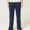 Pantaloni a zampa in maglia con risvolto in vita