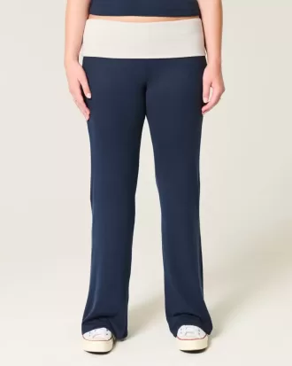 Pantaloni a zampa in maglia con risvolto in vita