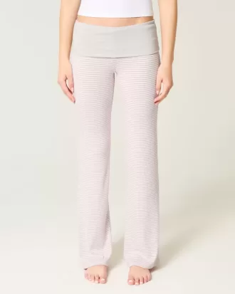 Pantaloni a zampa in maglia con risvolto in vita