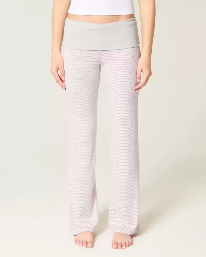 Pantaloni a zampa in maglia con risvolto in vita