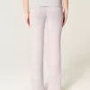 Pantaloni a zampa in maglia con risvolto in vita