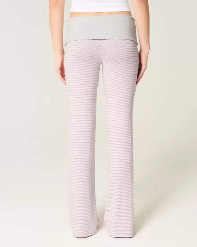 Pantaloni a zampa in maglia con risvolto in vita