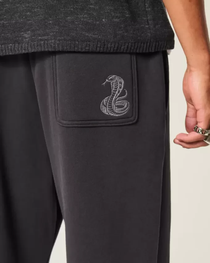 Pantaloni della tuta larghi con stampa serpente