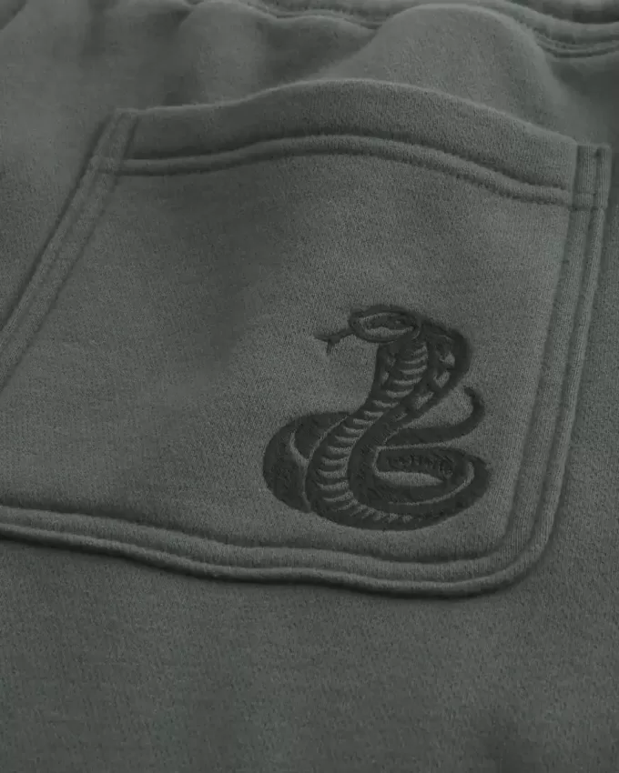Pantaloni della tuta larghi con stampa serpente
