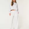 Pantaloni larghi in pile con logo in vita