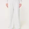 Pantaloni larghi in pile con logo in vita