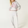 Pantaloni sportivi a gamba larga con grafica