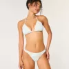 Slip bikini a sgambatura alta con spalline sottili