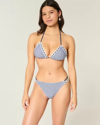 Slip bikini aderente con doppio cinturino e finiture in stile uncinetto