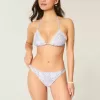 Slip bikini aderente con doppio cinturino e finiture in stile uncinetto Slip bikini aderente con doppio cinturino e finiture in stile uncinetto