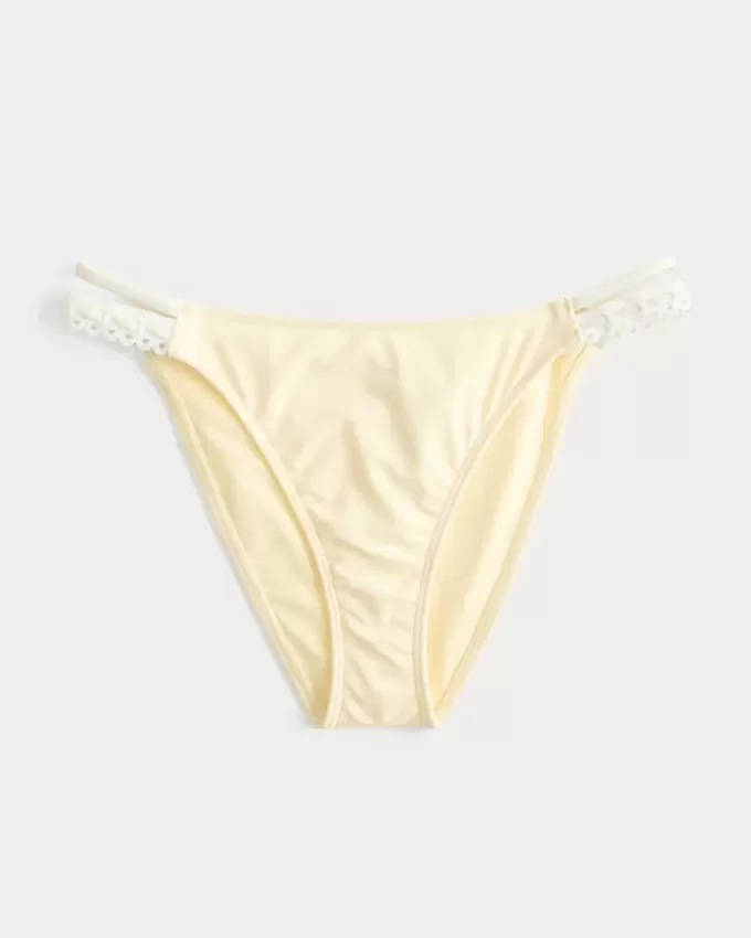 Slip bikini aderente con doppio cinturino e finiture in stile uncinetto Slip bikini aderente con doppio cinturino e finiture in stile uncinetto