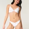 Slip bikini Cheekiest con occhielli e sgambatura alta
