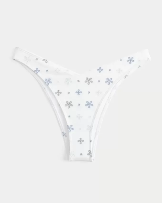 Slip bikini Cheekiest con occhielli e sgambatura alta