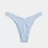 Slip bikini Cheekiest con occhielli e sgambatura alta