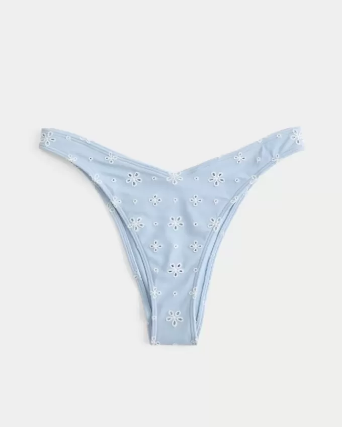 Slip bikini Cheekiest con occhielli e sgambatura alta