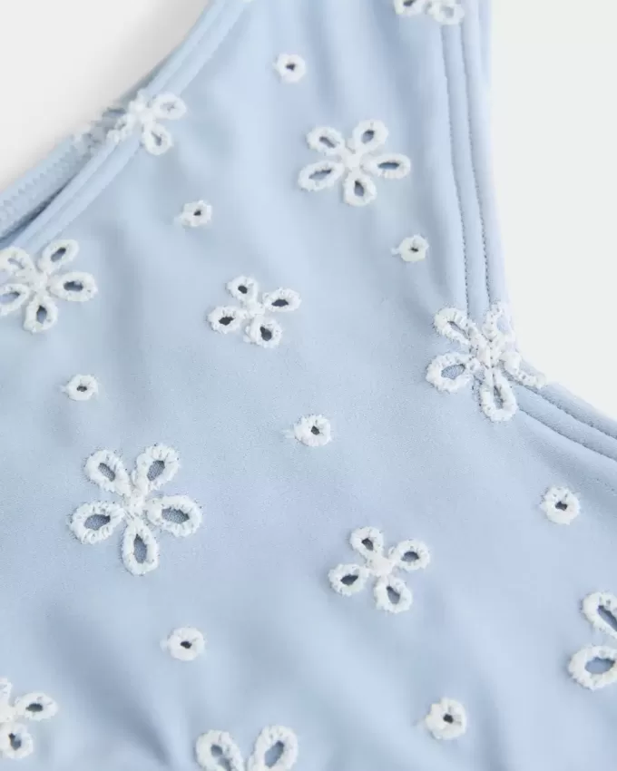 Slip bikini Cheekiest con occhielli e sgambatura alta